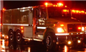 Emergency Vehicle Lit Up at Night