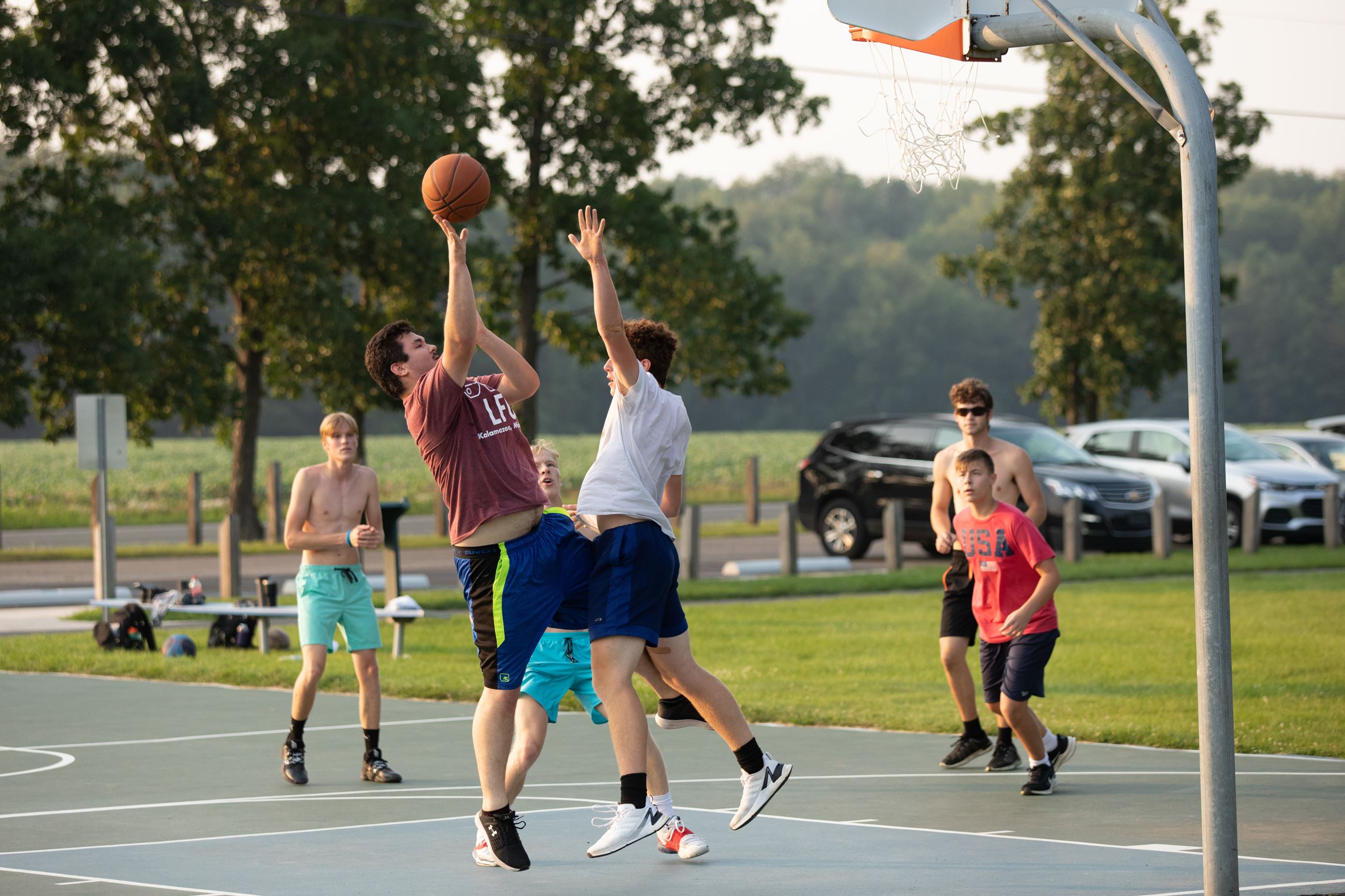 Boys Playing Basketball at Texas Drive Park